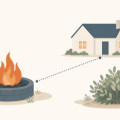 Flat illustration of a backyard fire pit with a dotted setback line to a house and a shrub nearby