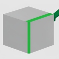 A green paint roller leaving a bright green stripe across a plain gray product box