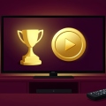 A TV screen showing a golden award statuette and a play button with a remote in the foreground