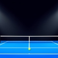 An empty blue tennis court at night under bright stadium floodlights with a single ball near the baseline