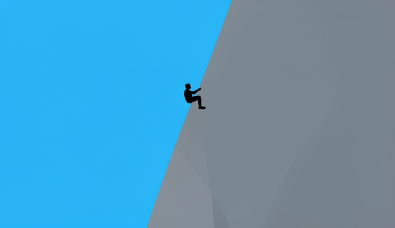 A small silhouette of a rock climber high on a tall vertical granite cliff against a blue sky